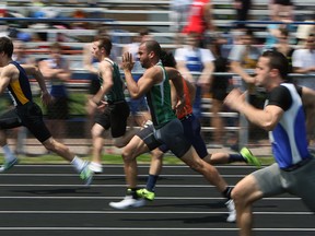 Runners compete in a qualifying heat of the men's 100m at the high school track meet at Sandwich in LaSalle on Tuesday, May 13, 2014. (TYLER BROWNBRIDGE/The Windsor Star)