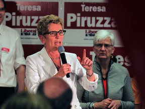 Premier Kathleen Wynne makes a stop at the headquarters of MPP Teresa Piruzza Tuesday May 20, 2014.  Hundreds of supporters jammed the small office to hear and see Premier Wynne.   (NICK BRANCACCIO/The Windsor Star)