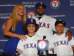 Prince Fielder of the Rangers poses for photos with his wife, Chanel and sons, Jaden, left, and Haven. (Photo by Ronald Martinez/Getty Images)