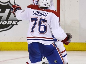 Montreal's Daniel Briere, top, celebrates his goal with P.K. Subban during the third period of Game 3 against the New York Rangers Thursday, (AP Photo/Seth Wenig)
