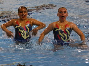 Waterloo Synchro swimmers Ria Syal, left, and Grace Payne perform at 2014 Ontario Open Synchronized Swimming Championships held at the Windsor International Aquatic and Training Centre Friday May 24, 2014.   (NICK BRANCACCIO/The Windsor Star)