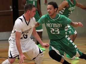 Herman's Trevelle Blythe, right, guards Massey's Justin Lalonde at Massey. (NICK BRANCACCIO/The Windsor Star)