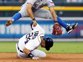 Texas second baseman Rougned Odor avoids Detroit's Miguel Cabrera during the fifth inning at Comerica Park. (AP Photo/Duane Burleson)