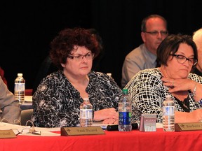 Director of Education, Paul Picard, left, Board Chair Barbara Holland, Vice Chair Mary DiMenna, Father Larry Brunet and Exec. Superintendant of Corp. Services, Mario Iatonna, behind, listen to delegations during Windsor-Essex County Catholic District School Board meeting held at Holy Names High School Tuesday May 27, 2014. (NICK BRANCACCIO/The Windsor Star)