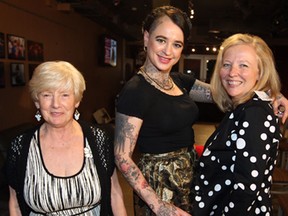 Christine Fullerton, left, Sarah Desrosiers and Michelle Fullerton attend Elaine Chatwood's Chatty Collection fashion show at The Star's News Cafe Wednesday May 28, 2014. (NICK BRANCACCIO/The Windsor Star)