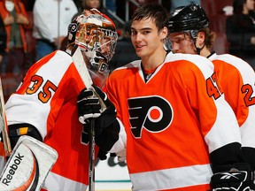 Ex-Spit Eric Wellwood, right, celebrates with Sergei Bobrovsky after the Flyers defeated the Carolina Hurricanes 3-2.