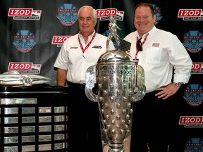 Roger Penske, left, and Chip Ganassi pose next to the Harley J. Hearl Daytona 500 Trophy and the Borg Warner Trophy as the two only team owners to have won both trophies. (Photo by Robert Laberge/Getty Images)