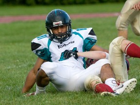 Essex wide receiver Martez Lambert, left, is tackled against the Niagara Spears at Raiders Field. (JOEL BOYCE/The Windsor Star)