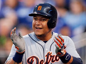 Detroit's Miguel Cabrera celebrates after scoring on a double by teammate Victor Martinez during the third inning in Kansas City, (AP Photo/Orlin Wagner)