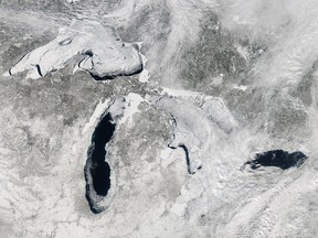 The Great Lakes are seen from space with ice covering 80.3 percent of the lakes on February 19, 2014. They are still 23.5 per cent covered in ice as of the end of April, compared with last year with five per cent. (Courtesy of NASA via Getty Images)