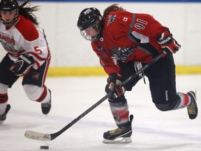 Southwest's Krystin Lawrence, right, is checked by Leaside's Kristen Lucas at Forest Glade Arena. (DAX MELMER/The Windsor Star)