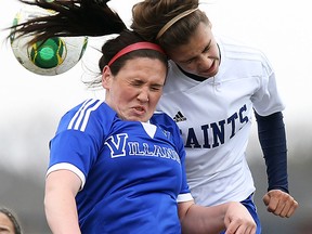 St. Anne's Hanna Drkulec, right, and Villanova's Jessica Kapasi collide in soccer action at St. Anne Monday. (TYLER BROWNBRIDGE/The Windsor Star)