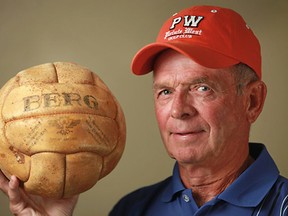 Windsor's Jimmy Stewart, Jr., holds the ball from the 1936 gold-medal basketball game at the Berlin Olympics. (Photo courtesy of Heritage Auctions)