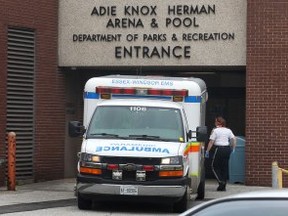 An ambulance is shown Monday, May 12, 2014, at the Adie Knox Herman Arena and Pool complex on Monday, May 12, 2014, in Windsor, Ont. where a man was found in the pool with no vital signs. (DAN JANISSE/The Windsor Star)