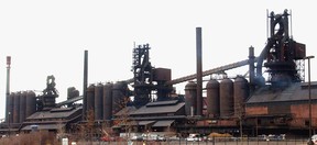 In this March 21, 2005 file photo, the Severstal steel plant in Dearborn, Mich., is shown. Permits have been updated for the Detroit-area steelmaker and an oil refinery, the state Department of Environmental Quality announced Monday, May 12, 2014. A 2014 permit for Dearborn-based Severstal expands testing requirements, adds emission limits for fine particulates, enhances emission and operational monitoring requirements and provides the DEQ with more tools to make sure the steelmaker continues to comply. (AP Photo/Carlos Osorio)