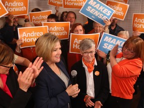 Ontario NDP leader Andrea Horwath (centre) campaigns with London North Centre NDP candidate Judy Bryant on May 16, 2014. (Dave Chidley / The Canadian Press)