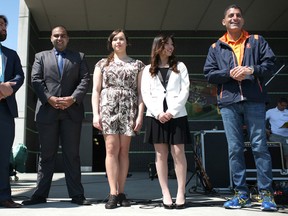 The Youth Leadership Award recipients, from left, Ronnie Haider, Foad Karimian, Regina Yuen, and Michelle Gajewski receive their awards from Mayor Eddie Francis, right at the City's 122nd Birthday Celebration at the Riverfront Festival Plaza in downtown Windsor, Monday, May 19, 2014.  (DAX MELMER/The Windsor Star)