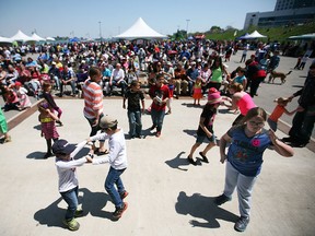 In this file photo, kids and their parents hit the dance floor at the City's 122nd Birthday Celebration at the Riverfront Festival Plaza in downtown Windsor, Monday, May 19, 2014.  (DAX MELMER/The Windsor Star)