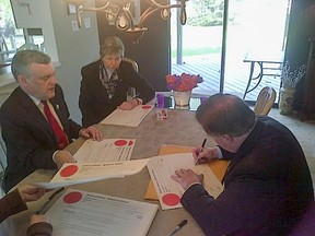 Lieut.-Gov. David Onley (far left) and fellow officials sign the writs of election for Ontario's 107 electoral districts, formally opening five weeks of electioneering until the June 12 provincial vote. (Twitter image)