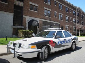A Windsor Police cruiser is parked outside of an apartment building at 16 Ellis Street, where a home invasion investigation was ongoing Saturday, May 10, 2014. (DAX MELMER/The Windsor Star)