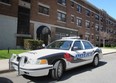 A Windsor Police cruiser is parked outside of an apartment building at 16 Ellis Street, where a home invasion investigation was ongoing Saturday, May 10, 2014. (DAX MELMER/The Windsor Star)