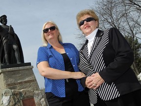 Denisa Blackburn, left,  and her mother Bernardina Uzonyi  stand in front of the Giovanni Caboto statue at the Caboto Club in Windsor on Wednesday, May 8, 2014. Both women are upset the Caboto Club refuses to accept woman as voting members.            (TYLER BROWNBRIDGE/The Windsor Star)