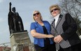 Denisa Blackburn, left,  and her mother Bernardina Uzonyi  stand in front of the Giovanni Caboto statue at the Caboto Club in Windsor on Wednesday, May 8, 2014. Both women are upset the Caboto Club refuses to accept woman as voting members.            (TYLER BROWNBRIDGE/The Windsor Star)