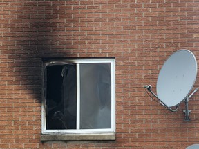 A body was discovered inside an apartment unit in the 1000 block of California Avenue following a fire on Monday, May 12, 2014. Heavy smoke damage is shown from the second storey window of the apartment. (DAN JANISSE/The Windsor Star)