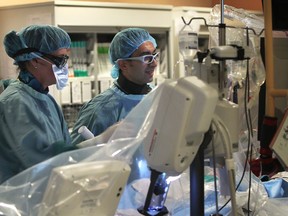Dr. Roland Mikhail, right, and RN Lisa Chiarotti perform an angioplasty procedure on Tuesday, May 13, 2014, at the Windsor Regional Hospital, Ouellette Campus.  (DAN JANISSE/The Windsor Star)