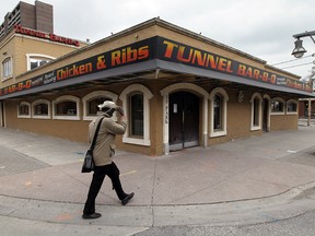 In this file photo, a pedestrian walks past a Windsor institution: Tunnel Bar-B-Q on Park Street East, May 2, 2014. (Tyler Brownbridge / The Windsor Star)