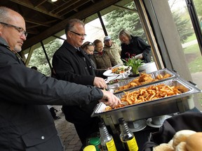 Great Lakes fish and chips was served during a news conference on Fighting Island in LaSalle on Wednesday, May 7, 2014. The Tainting of Fish and Wildlife Flavour was removed from the list of Beneficial Use Impairments from the river’s Area of Concern   (TYLER BROWNBRIDGE/The Windsor Star)