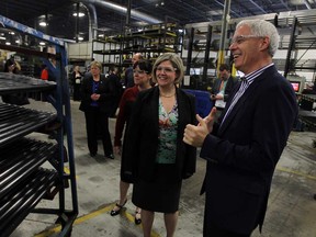 Ontario NDP leader Andrea Horwath (centre) is joined by local candidate Lisa Gretzky (left) as they receive a plant tour from Jim Scott (right) at Ground Effects in Windsor on Friday, May 9, 2014. (TYLER BROWNBRIDGE/The Windsor Star)