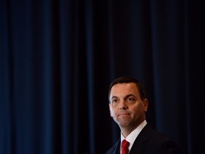 Ontario PC Party leader Tim Hudak stands before a blue curtain at a speaking engagement in Ottawa on May 13, 2014. (Sean Kilpatrick / The Canadian Press)