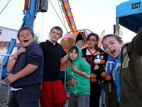 Friends, from left to right, Tristan Luno, 12, Jacob Dixon, 13, Tanner Labelle, 12, Jewel Wood, 11, and Michael Di Maio, 12, attend the Tecumseh Mall Spring Fling, Sunday, May 18. Many Windsorites took advantage of the long weekend and weather by getting outdoors. (RICK DAWES/The Windsor Star)