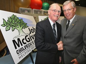 In June 2006, it was announced the Children's Rehabilitation Centre of Essex County would  be renamed in honour of John McGivney, left.  Congratulating McGivney was president Stephen Payne.  The Windsor Star/Scott Webster