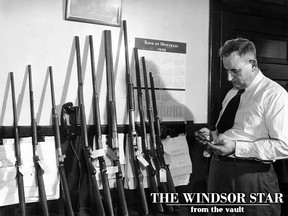 Leamington police Chief Earl Cooper is shown examining a revolver on Jan. 13, 1949. The gun was part of the arsenal taken from the gun repair shop of E. McCormick, on Maple Street, Leamington, which was broken into by three members of the "Nighhawks", a Leamington teen-aged gang who wanted to get in some "Commando training" and become Robin Hoods who would steal from the rich for the benefit of the poor. (FILES/The Windsor Star)