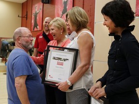 Ed Payne, left, congratulates Canadian Red Cross rescuer award recipients Andy Sullivan, Vanessa Joubert, Eva Beattie, Debbie Leffelhoc and Marie-Claire Simonetti on May  22, 2014, a group of people who saved his life after he suffered cardiac arrest at Goodlife Fitness at Devonshire Mall.  (JASON KRYK/The Windsor Star)