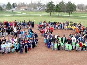 Windsor Central Little League players and their families form the shape of a 50 to celebrate the league's 50th season at Optimist Park on Saturday, May 3, 2014.  (REBECCA WRIGHT/ The Windsor Star)