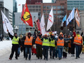 First Nations demonstrators march on Parliament Hill in Ottawa in this February 2014 file photo. (Sean Kilpatrick / The Canadian Press)