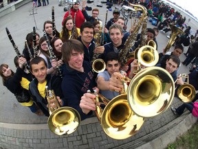 Members of the Herman Secondary School band are all smiles as they celebrate Massive Music Monday on May 5, 2014, during the national event sponsored by The Coalition for Music Education to celebrate music in our schools by sharing it with their communities.  More than 400 area student took part in the event on the waterfront. (JASON KRYK/The Windsor Star)