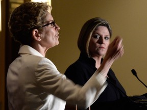 In this file photo, Ontario Liberal Leader Kathleen Wynne, left, and Ontario NDP Leader Andrea Horwath take part in the northern leaders' debate in Thunder Bay on Monday, May 26, 2014. THE CANADIAN PRESS/Frank Gunn