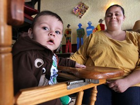 Malerie Giron, 28 and her son Eli Nathan, 7 months, are shown Tuesday, May 6, 2014, at the Windsor Youth Centre in Windsor, Ont. Giron participates in the Prepared Parents Program. (DAN JANISSE/The Windsor Star)