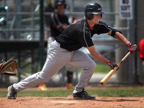Nick O'Neil of teh Windsor Selects lays down a sacrifice bunt against the Ontario Blue Jays during PBLO action at Cullen Field, Sunday, May 11, 2014. The Selects lost 6-4. (DAX MELMER/The Windsor Star)