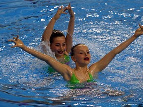 Toronto Synchro swimmers Greer Kelly, front, and Catherine McGee perform at 2014 Ontario Open Synchronized Swimming Championships held at the Windsor International Aquatic and Training Centre Friday May 24, 2014.  (NICK BRANCACCIO/The Windsor Star)