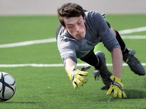 Lajeunesse goaltender Alexandre Simard dives as the ball slips past into the net during the boys A soccer final against Forster in Windsor, Ontario. Forster defeated Lajeunesse 4-0.(JASON KRYK/The Windsor Star)