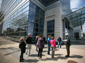 Adam Coates from the City of Windsor planning department, gives a tour of downtown Windsor to a group of Americans taking part in the National Main Streets Conference being held in Detroit, MI, Sunday, May 18, 2014.  (DAX MELMER/The Windsor Star)