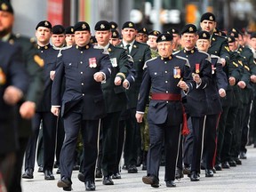 The National Day of Honour was recognized in Windsor, Ont. on Friday, May 9, 2014, during a ceremony at the downtown cenotaph. Members from several local military branches march during the event. (DAN JANISSE/The Windsor Star)