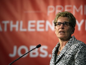 Premier Kathleen Wynne addresses the media following a tour of Omega Tool Corp. during a campaign stop in Windsor on Wednesday, May 21, 2014.             (TYLER BROWNBRIDGE/The Windsor Star)