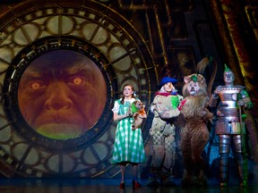 Danielle Wade as Dorothy, Jamie McKnight as Scarecrow, Lee MacDougall as Lion, Mike Jackson as Tin Man in The Wizard of Oz. (Courtesy of Mirvish Productions Toronto)