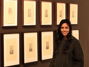 Artist Hajra Waheed with her exhibit at the Art Gallery of Windsor in the spring 2013. (NICK BRANCACCIO / Windsor Star files)